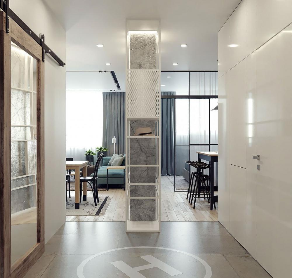 Chủ căn hộ có cách phân chia không gian khá thông minh khi dùng bức tường ở chính giữa lối đi vào để phân nơi ở thành 2 khu vực, một bên là phòng khách, một bên là nơi nghỉ ngơi. phân chia không gian căn hộ