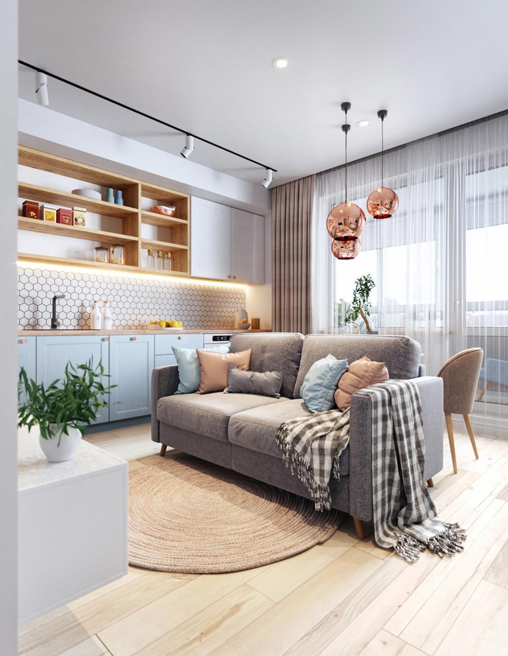 Chủ nhà không dùng bàn trà, khu tiếp khách chỉ gồm sofa đơn và một tấm thảm tròn để không gian bớt lộn xộn khu tiếp khách